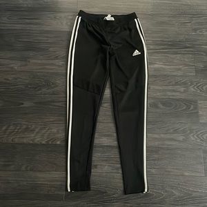Adidas women track pant in new condition, no stains.